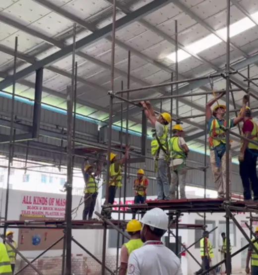 Trainees building scaffolding
